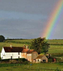 Amazing rainbow with house in the foreground
